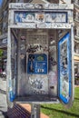 Thessaloniki, Greece, April 27, 2023: Public phone box full of stickers and paint scrawling in the city centre of Thessaloniki on Royalty Free Stock Photo