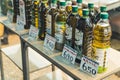 07.13.2022 Thessaloniki, Greece. Different kinds of pure Greek olive oil in plastic and glass transparent bottles with