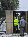 Thessaloniki, Greece Gas technician inspects a distribution pipe under bad weather.