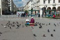 THESSALONIKI, GREECE - MAY 29, 2017: Famous Aristotelous square in Thessaloniki, Greece. Woman selling seeds for the pigeons.