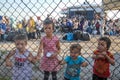 Refugee children disembark in the port of Thessaloniki after being transfered from the refugee camp of Moria, Lesvos island