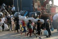 Refugees and migrants disembark to the port of Thessaloniki after being transfered from the refugee camp of Moria, Lesvos island