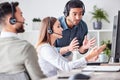 Theyll solve it together. a group of young call center agents working together in their office. Royalty Free Stock Photo