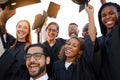 Theyre all in high spirits today. a group of university students celebrating their graduation. Royalty Free Stock Photo