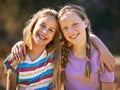 Theyre the best of friends. Portrait of two young girls standing together in the outdoors. Royalty Free Stock Photo