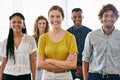 Theyre a bunch of go-getters. Cropped portrait of a diverse group of young colleagues standing in a brightly lit office.