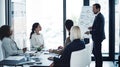 Theyre a detail-oriented team. a corporate businessman giving a presentation to his colleagues in the boardroom.