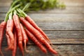 Theyre an excellent source of vitamins, nutrients, and fibre. a bunch of fresh carrots on a table. Royalty Free Stock Photo