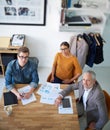 Theyre an extraordinary design team. Portrait of creative businesspeople having a meeting around a table. Royalty Free Stock Photo