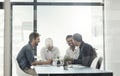 Theyre innovators of business. a group of businessmen having a meeting around a table in an office. Royalty Free Stock Photo