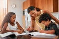 Theyre just as clever as their mom. a dad helping his children with their homework.