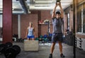 Theyre making this workout count. two people working out with kettlebells in a gym. Royalty Free Stock Photo