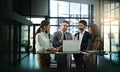 Theyre a team with lofty ambitions. a group of businesspeople meeting in the office.