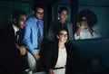 Theyre a team of overachievers. Cropped shot of a diverse group of businesspeople gathered around a single computer in