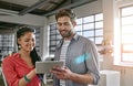 Theyre on to some winning ideas. two colleagues using a digital tablet together in a modern office. Royalty Free Stock Photo