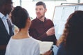 Theyre unstoppable when they combine their expertise. a group of businesspeople brainstorming in an office.