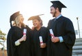 Theyve been buddies since day one. a group of students holding their diplomas on graduation day.