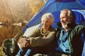 Theyve chosen a spot with some great views. a senior couple camping together in the wilderness.