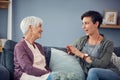 Theyve always shared everything with each other. an affectionate young woman having a conversation with her senior Royalty Free Stock Photo