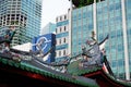 Thian Hock Keng Temple roof and modern skyscrapers