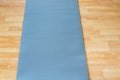 Thick anti slip blue fitness yoga practice or meditation mat on