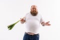 Thick bearded guy with healthy onion Royalty Free Stock Photo