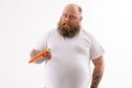 Thick bearded guy with healthy vegetable Royalty Free Stock Photo