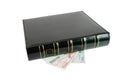Thick black book on euro bills isolated Royalty Free Stock Photo
