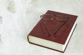 A thick book and glasses on the table. A book and glasses on a light background. Close up, copy space Royalty Free Stock Photo
