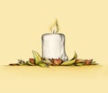Thick candle with autumn leaves