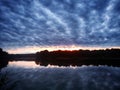 Thick Clouds Over Oxbow Lake at Sunset Royalty Free Stock Photo