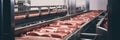 Thick cuts of raw meat on a conveyor belt pink fresh factory line.