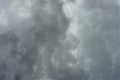 Thick dark gray strato cumulus clouds blanket the sky
