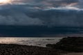 Thick dark thunderclouds above the sea Royalty Free Stock Photo