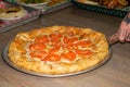 Thick Deep Dish Crust Cheese Pizza with big bright red tomatoes Royalty Free Stock Photo