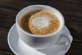 Thick foam of hot coffee cappuccino on wooden table, closeup. Milk foam cappuccino, latte Royalty Free Stock Photo