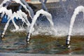 Thick foaming jets of water burst from metal cannons in the city`s granite fountain