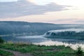 Thick fog on the river Bank