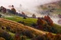 Thick fog on hilly rural fields in autumn Royalty Free Stock Photo