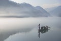 Thick fog on the lake, boats, wetlands