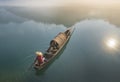 Thick fog on the lake, boats, wetlands