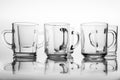 Thick glass mugs stacked. Drinking water storage containers