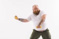 Thick guy exercising with weights Royalty Free Stock Photo