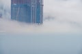 Thick large and heavy mist cover the under construction skyscrapers Royalty Free Stock Photo