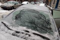 Thick layer of ice covering car after freezing rain Royalty Free Stock Photo