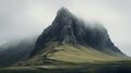 Thick mist surrounding a rugged mountain top