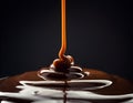 Thick molten chocolate dripping in a thin stream, creating glossy ripples and smooth layers in a dark minimal macro composition. Royalty Free Stock Photo