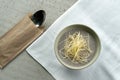 Thick mushroom cream soup with grated cheese.