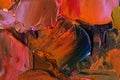 Thick oil paint. Close up view of volumetric brushstrokes of colorful paints. abstract artwork. Paint facture on canvas.