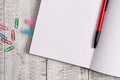 Thick pages notebook stationary on the top of a wooden table. Writing equipment placed above classic look backdrop